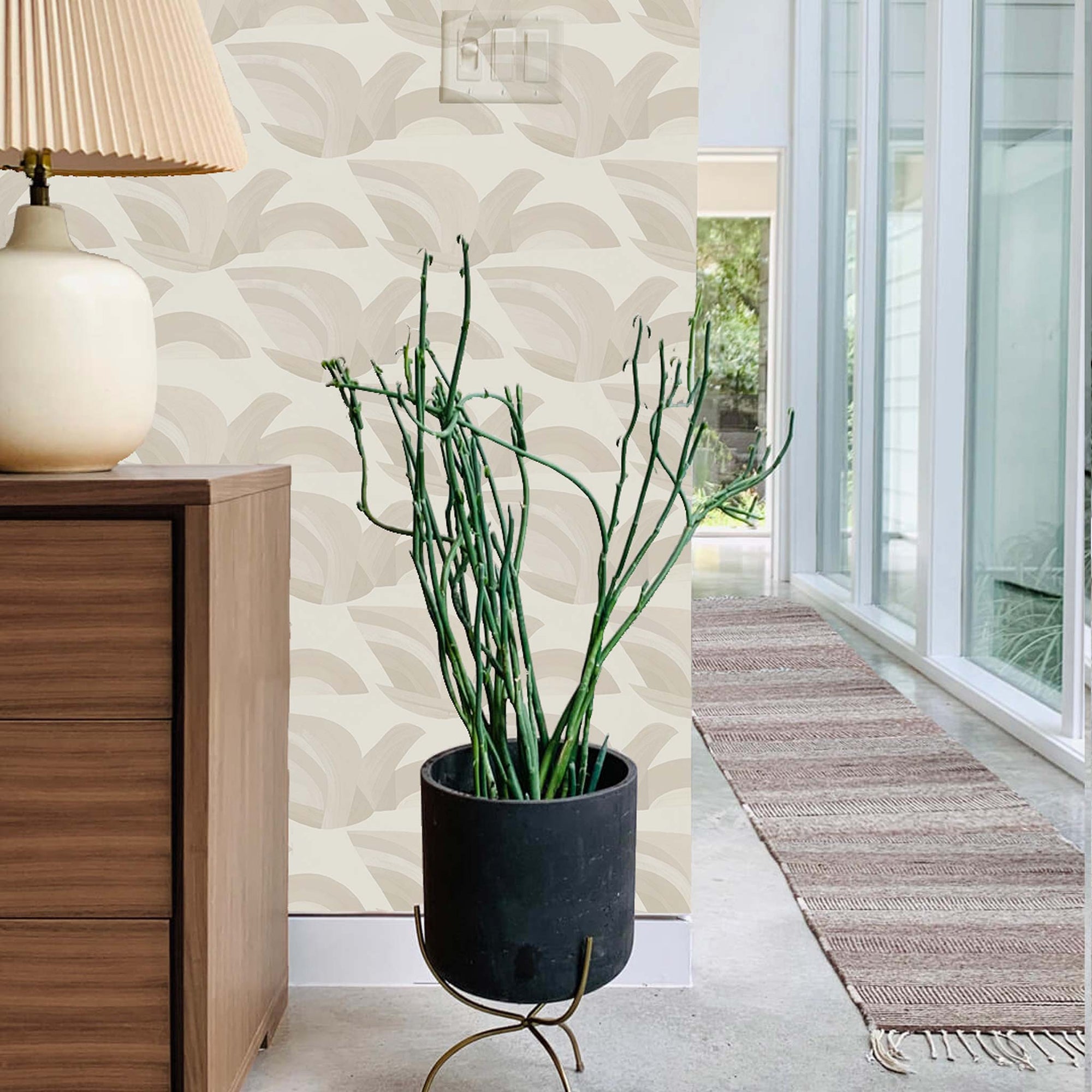 Modern bedroom hallway with tall windows and sand colored wallpaper repeating pattern of a bird